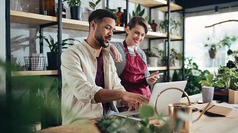 two small business owners at computer