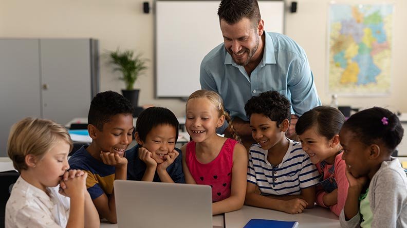 Banker with kids in a classroom