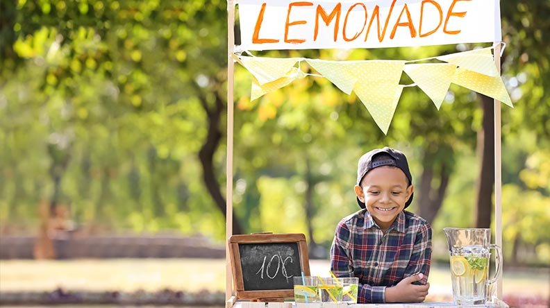 young boy and his lemonade stand