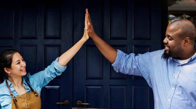 business owners high five